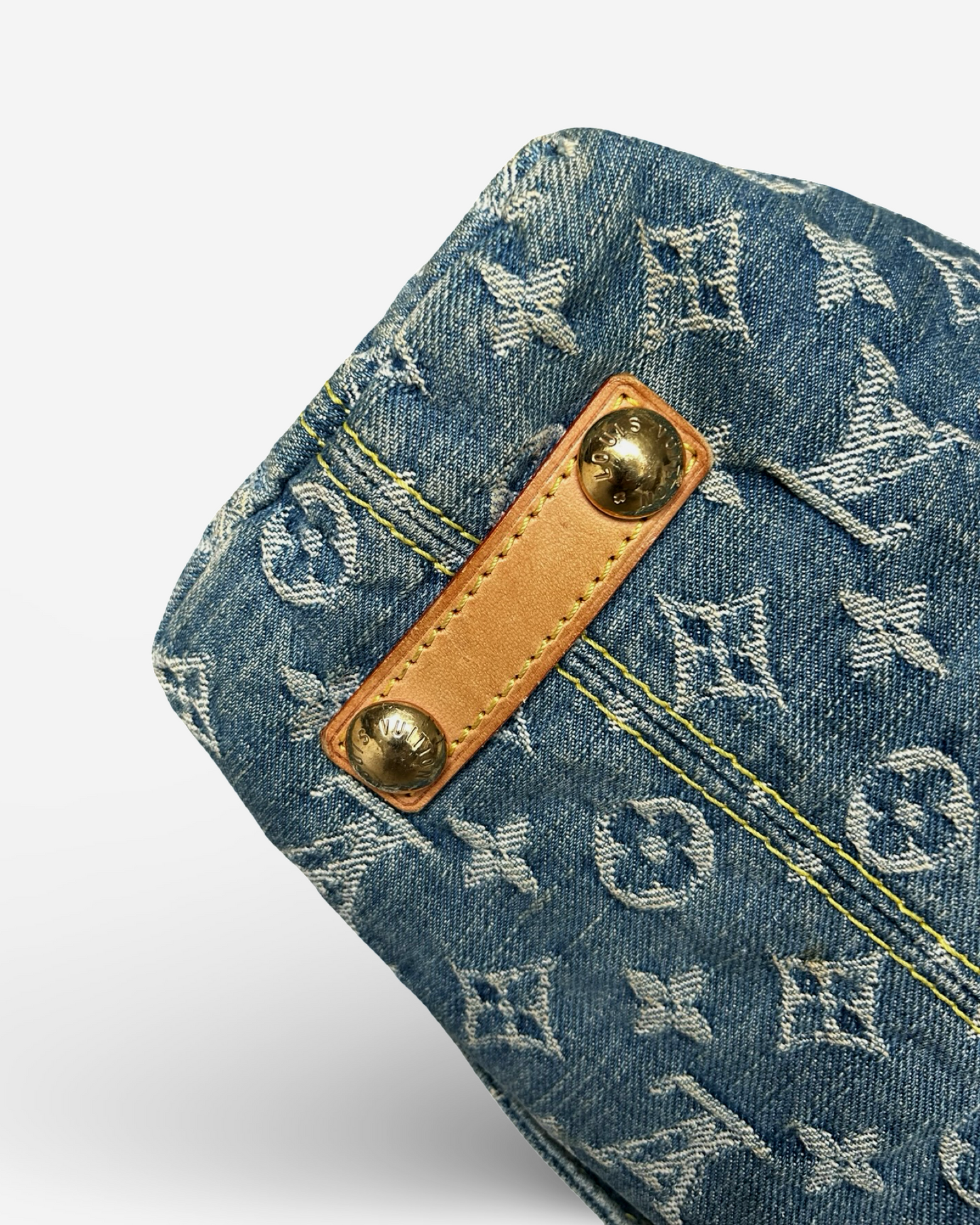 Louis Vuitton Monogram Denim Baggy GM Shoulder Bag close-up showcasing denim fabric and Vachetta leather trim.