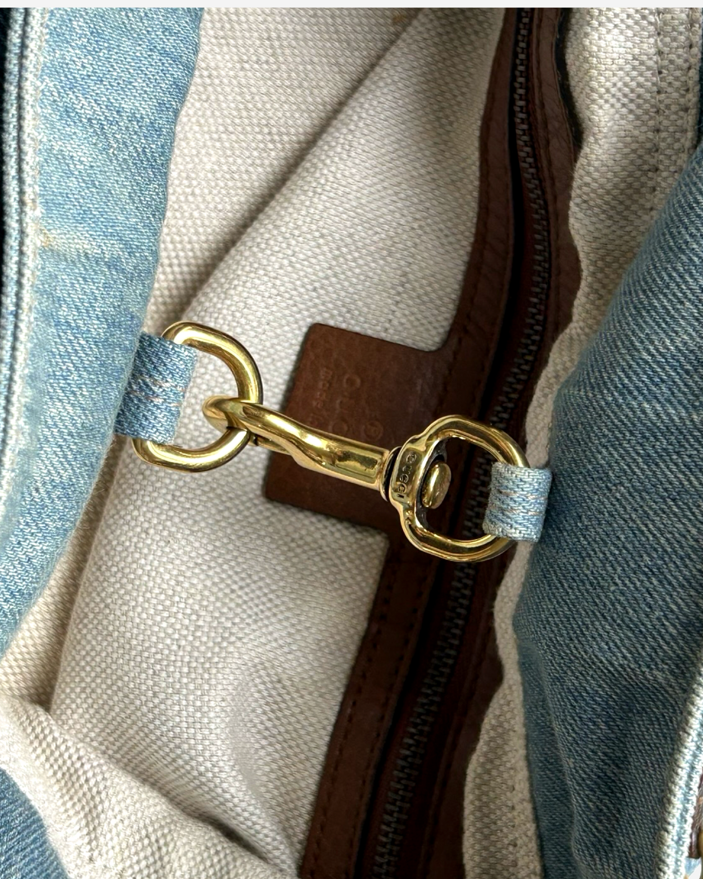 Gold-tone hardware detail on pre-owned Gucci Soho Denim Shoulder Bag in blue denim
