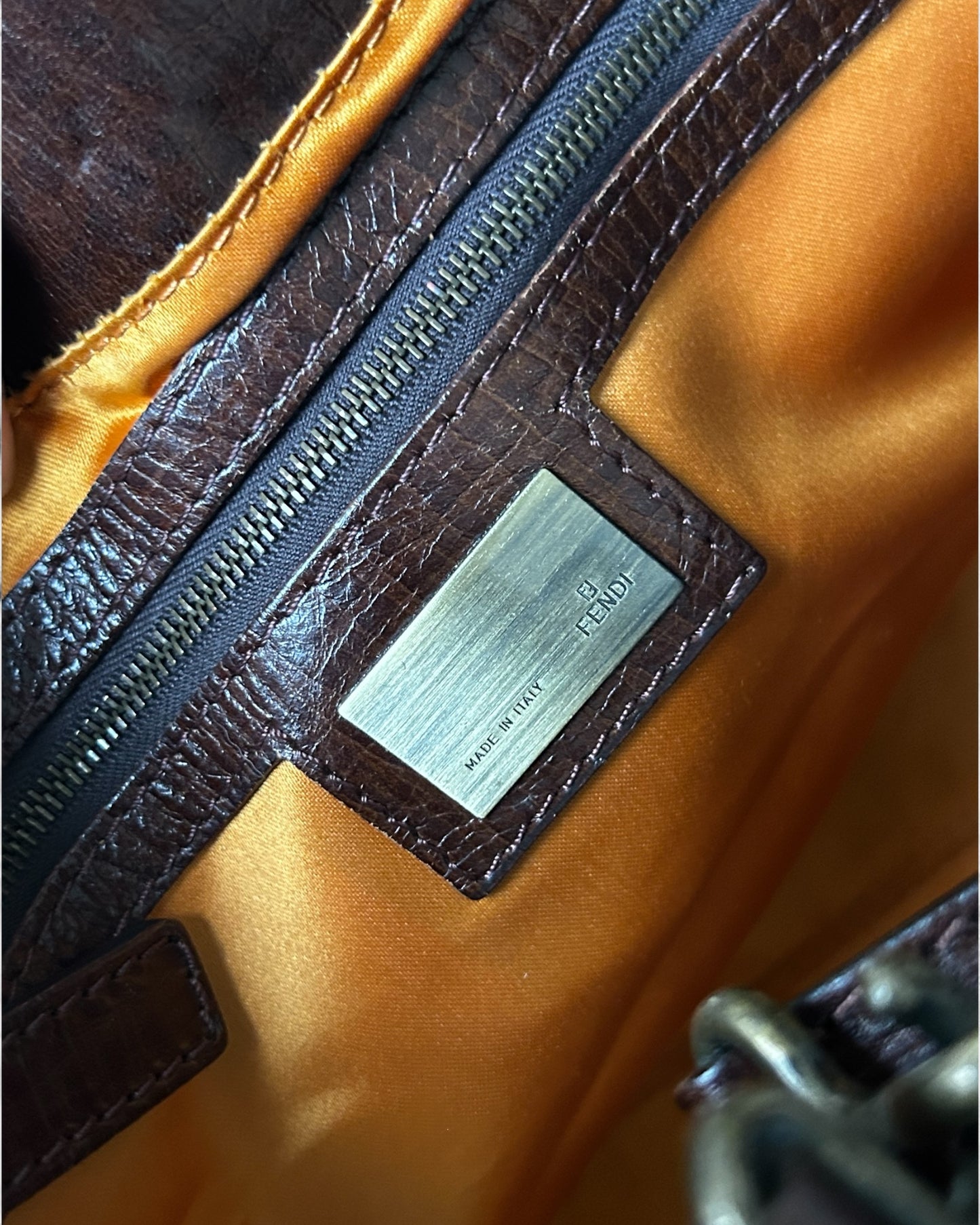 Logo plate inside fendi denim hand bag