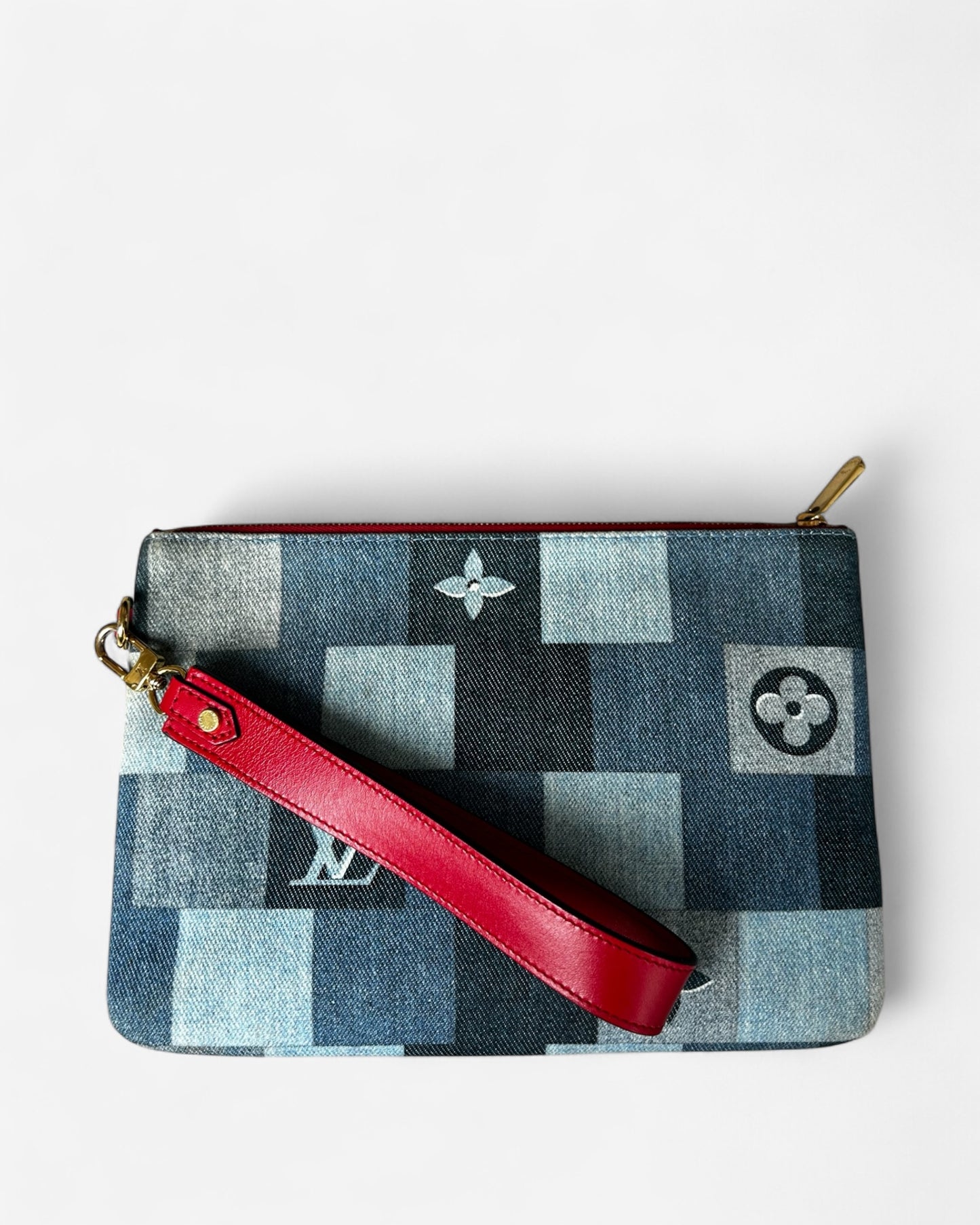 front view of lv denim city pouch with red leather strap