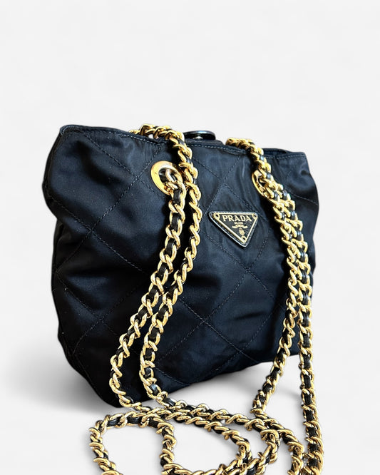 Prada nylon chain shoulder bag in black – side profile with leather and gold-tone strap