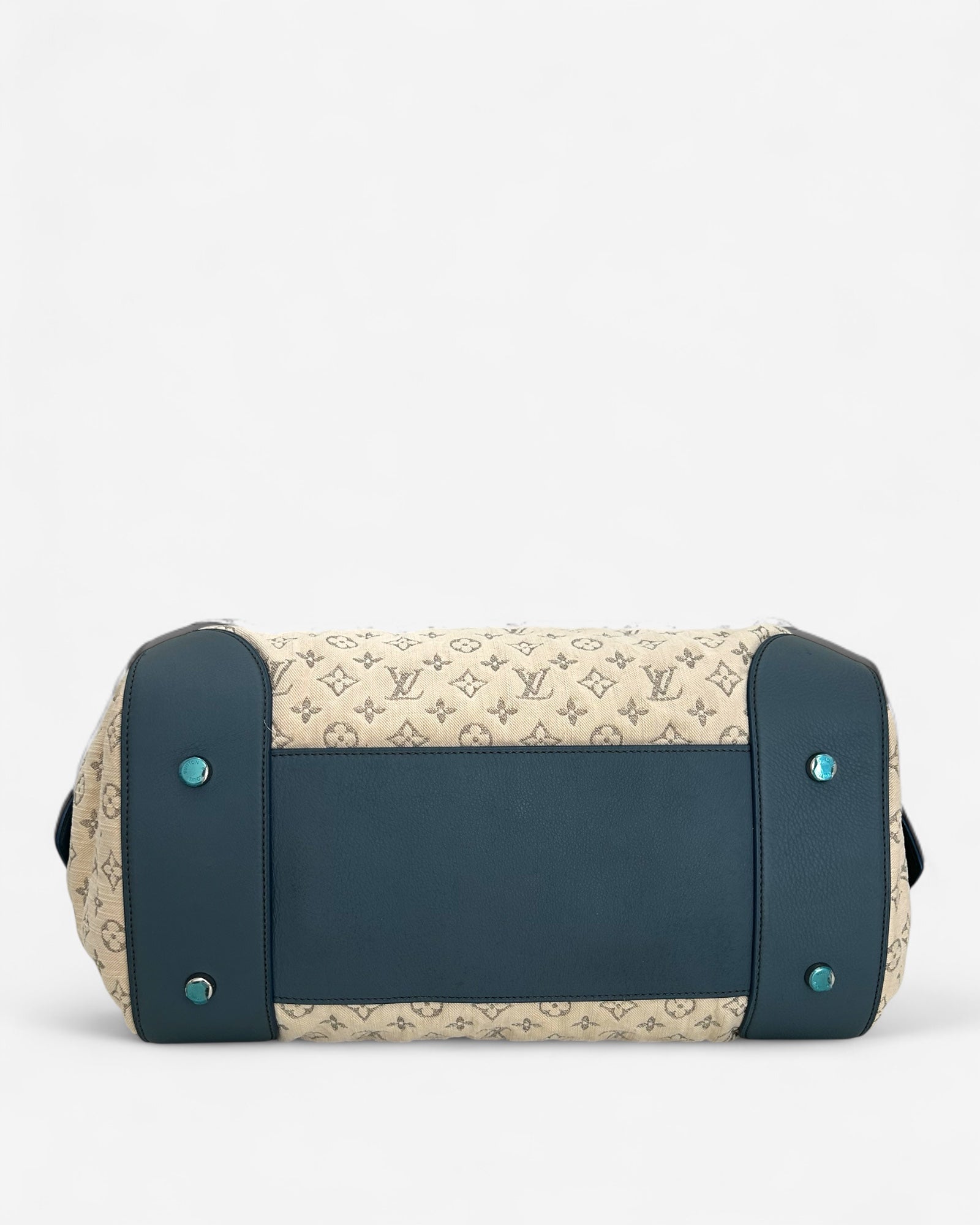 Base with protective metal feet of Louis Vuitton Speedy Round bag in white Monogram denim – limited edition 2012