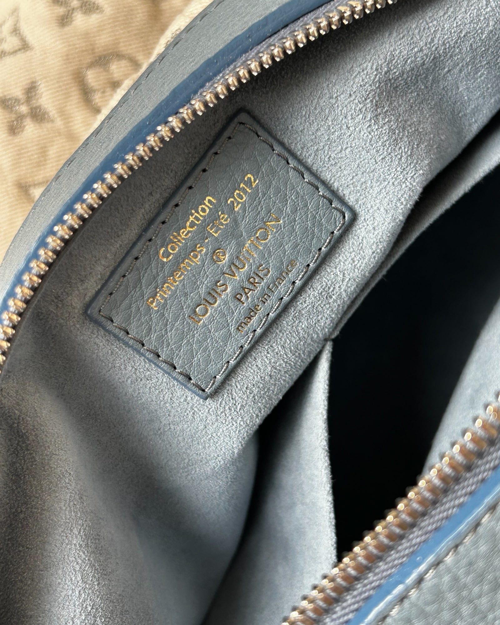 Close-up of Louis Vuitton Monogram logo on Speedy Round bag in white stonewashed denim – 2012 limited edition
