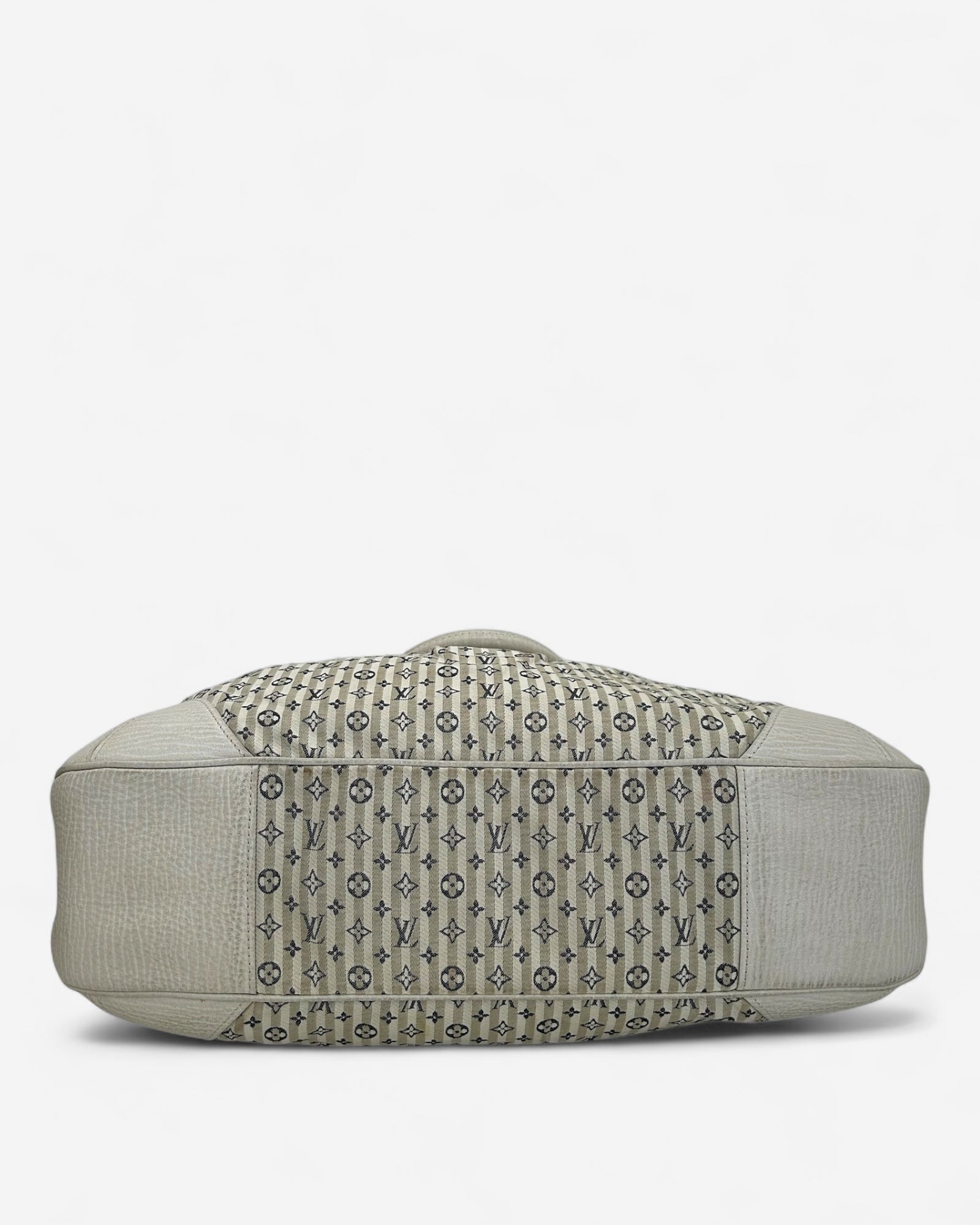 bottom view of monogram mini lin bag showing leather base