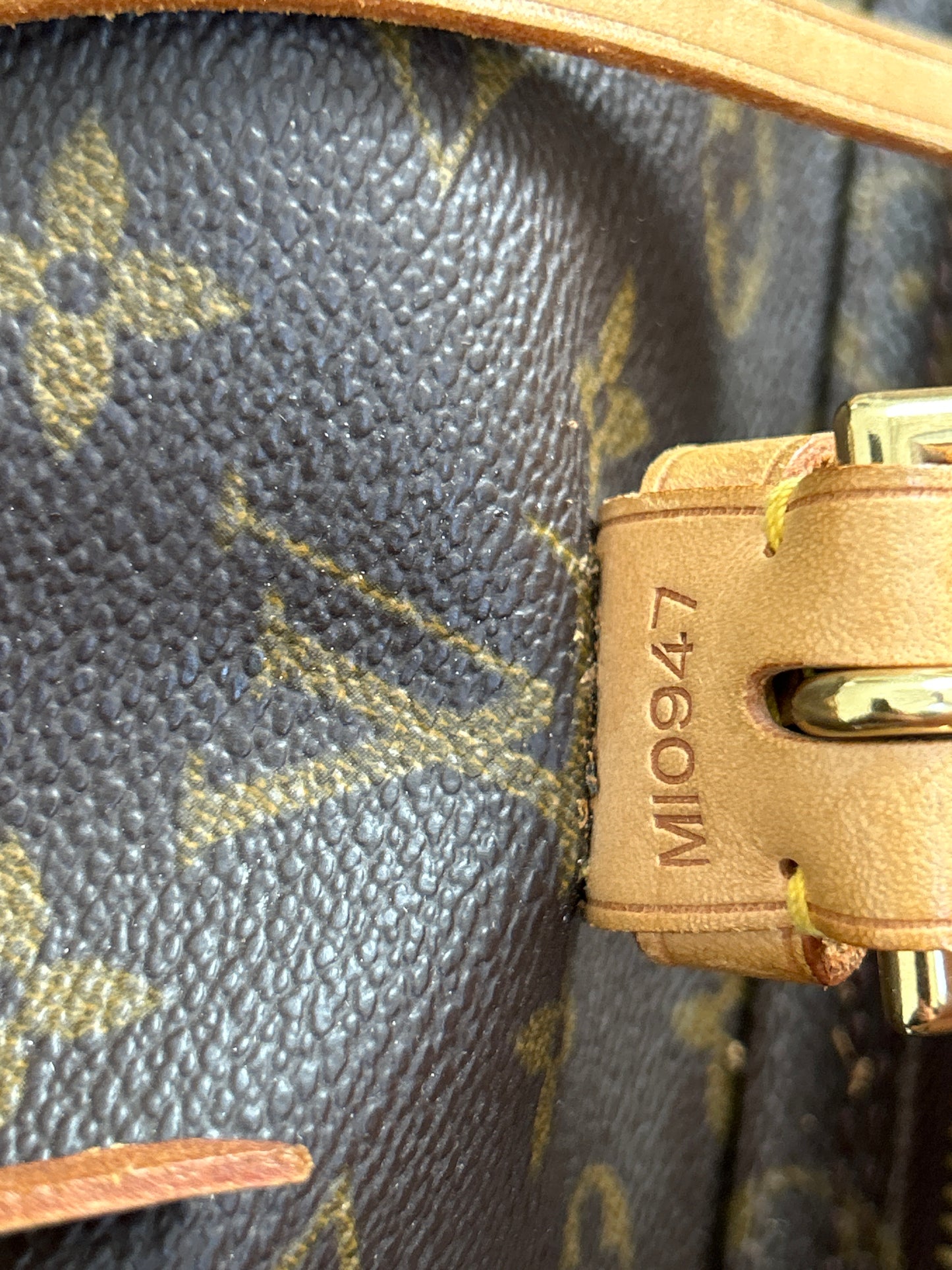 date code tag inside louis vuitton montsouris mm backpack