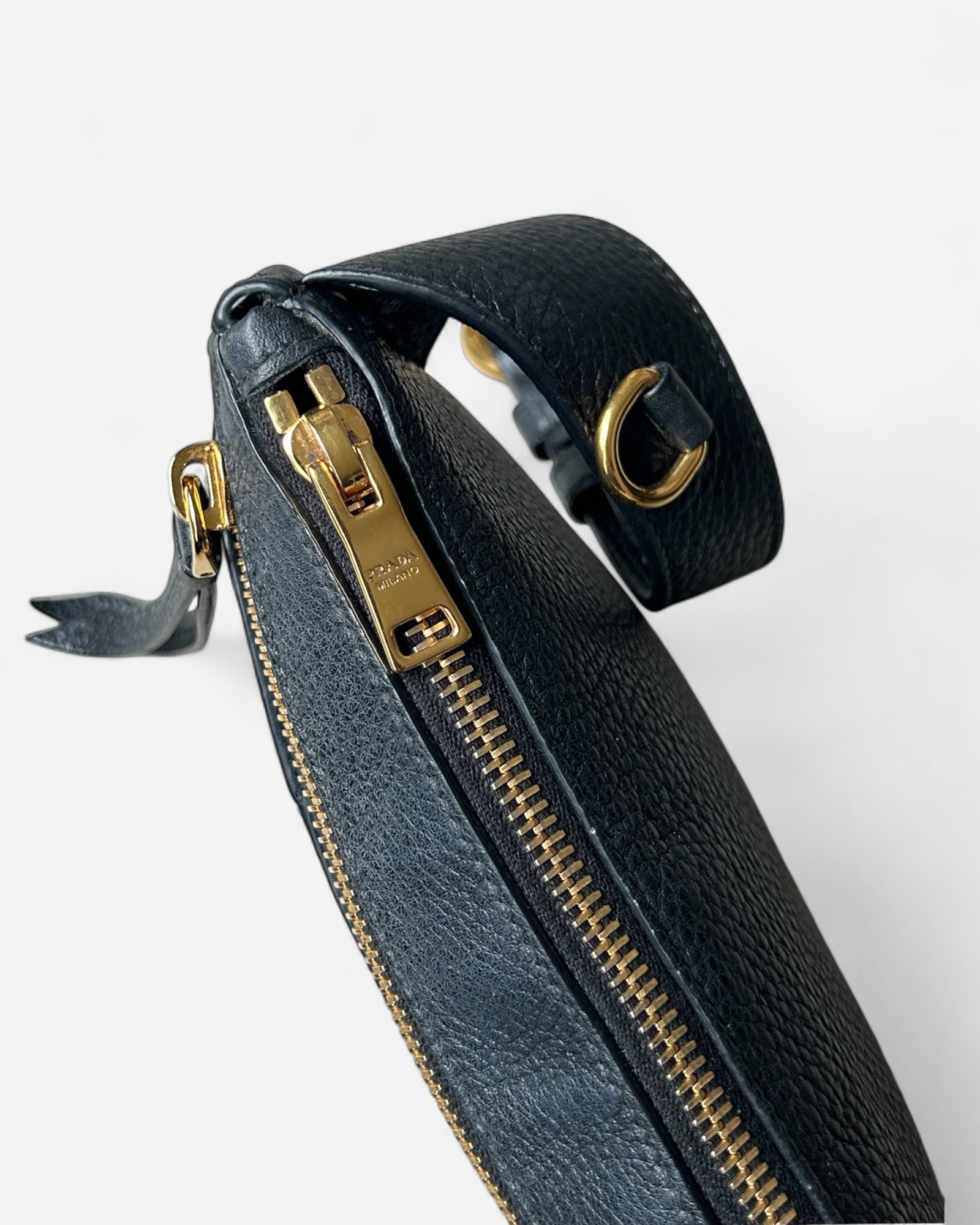 zipper and hardware detail on prada belt bag