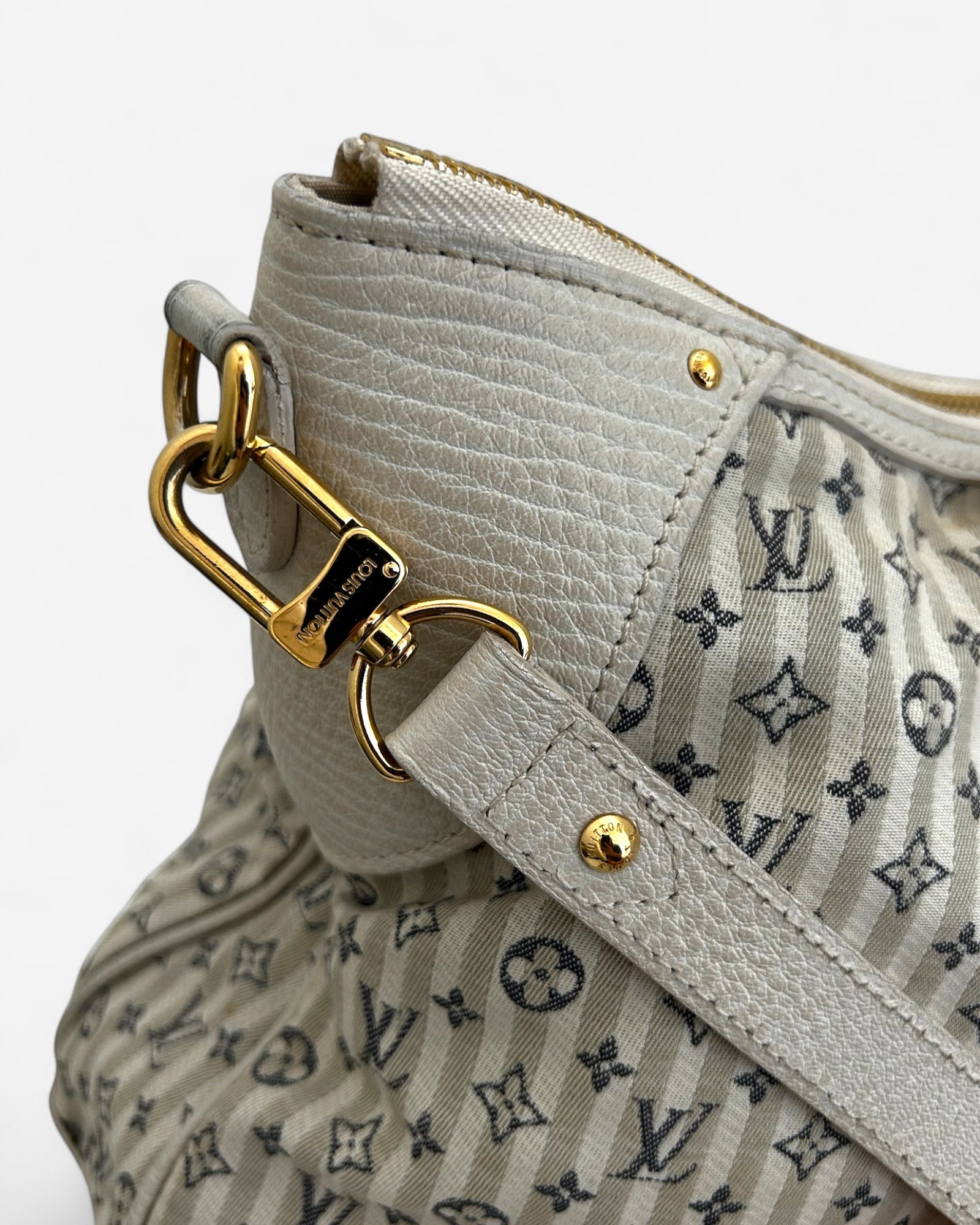 gold-tone hardware and zipper detail on lv croisette marina